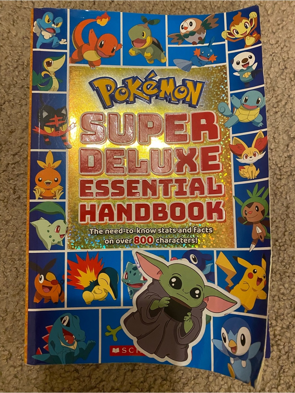 Scholastic Pokémon Super Deluxe Essential Handbook - Yellow & Blue Cover